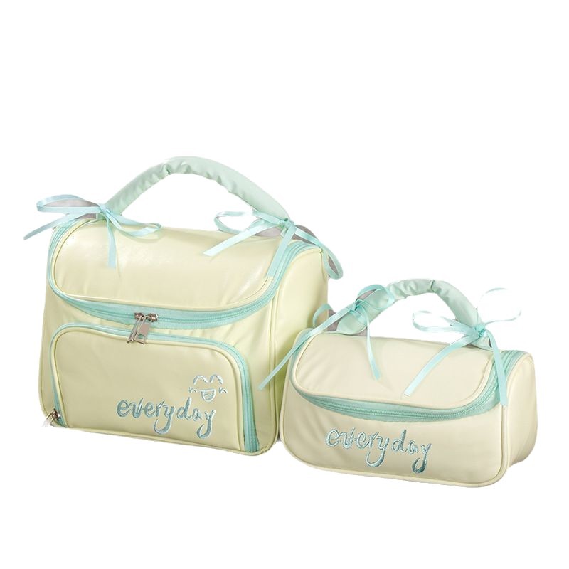 Capacious handheld cosmetic bag with bow to go out