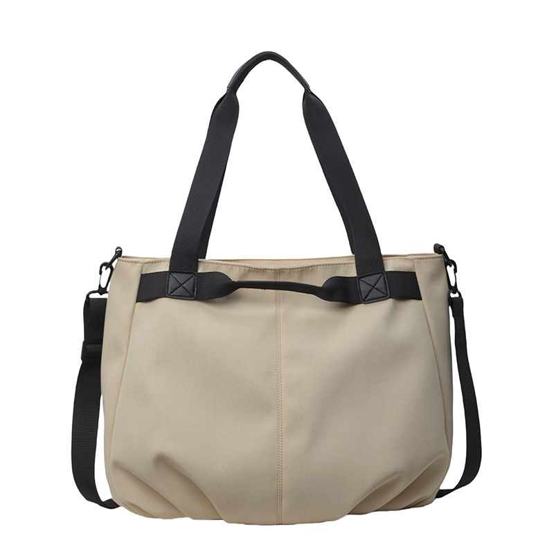 Bolsos de viaje transfronterizos de gran capacidad Bolsos de tela Oxford simples de moda femenina Bolsos tote de todo fósforo Bolsos de hombro de moda coreana