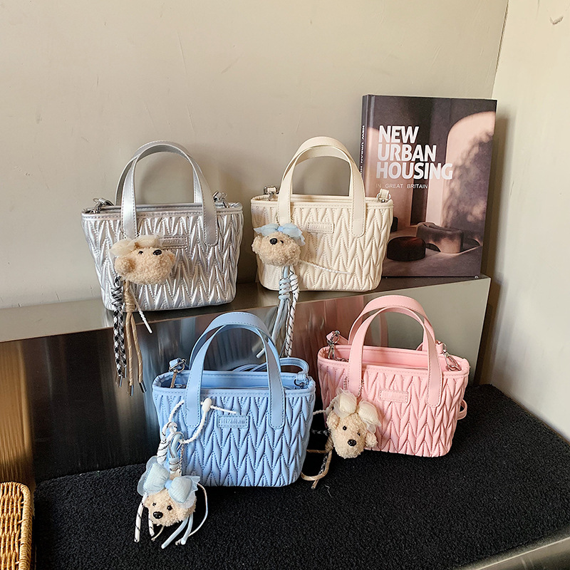 Coreano simple bolso de mano plegable de color sólido bordado de estilo extranjero bolso de hombro para hombres y mujeres nuevos accesorios para niños transfronterizos