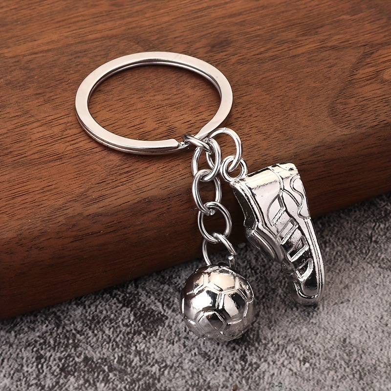 Serie de oro de aleación de venta transfronteriza caliente fútbol béisbol rugby sombrero hechicero puño llavero colgante mochila
