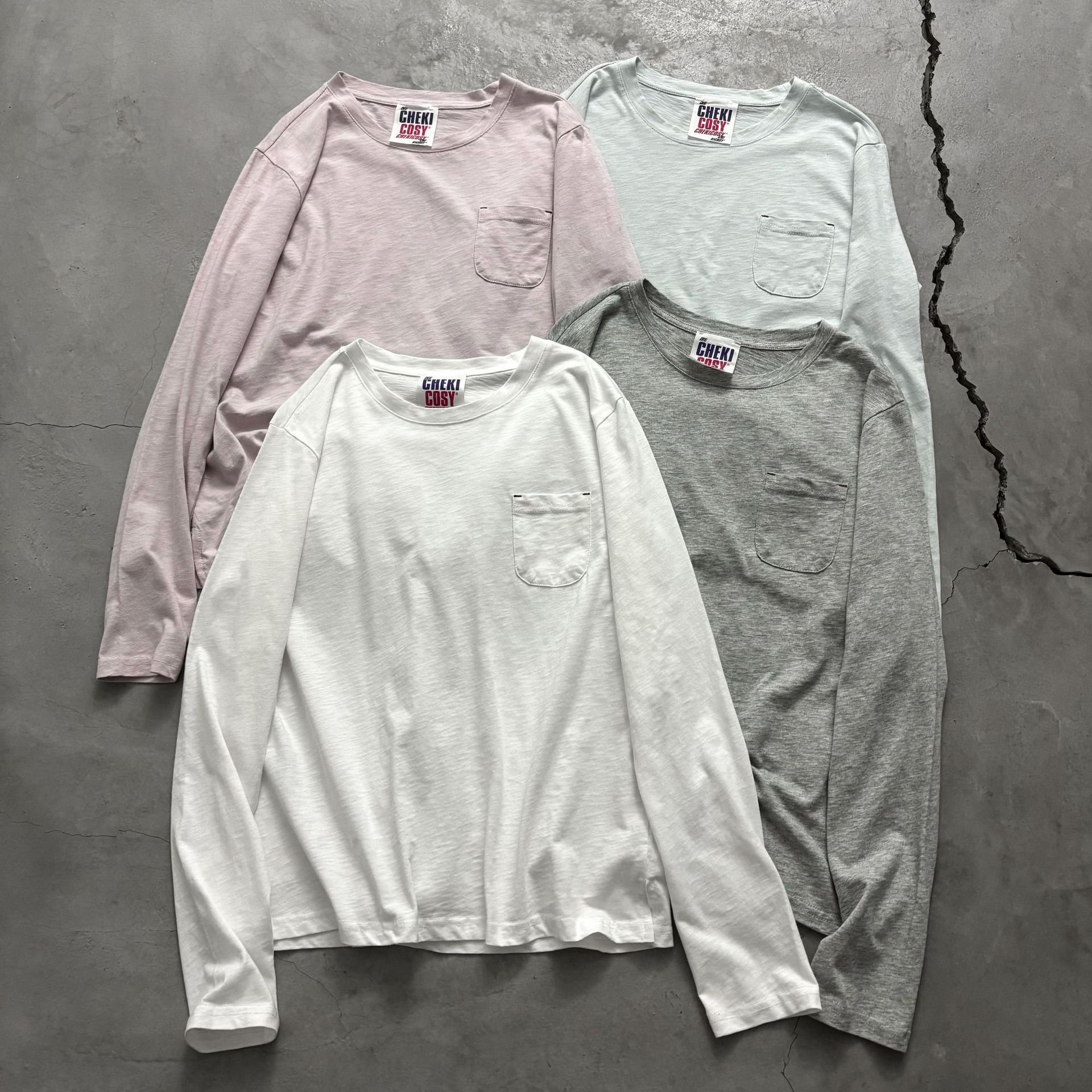 Korean-style minimalist round neck long-sleeved T-shirt with small pocket decoration, loose fit, versatile basic solid color bamboo cotton base layer.
