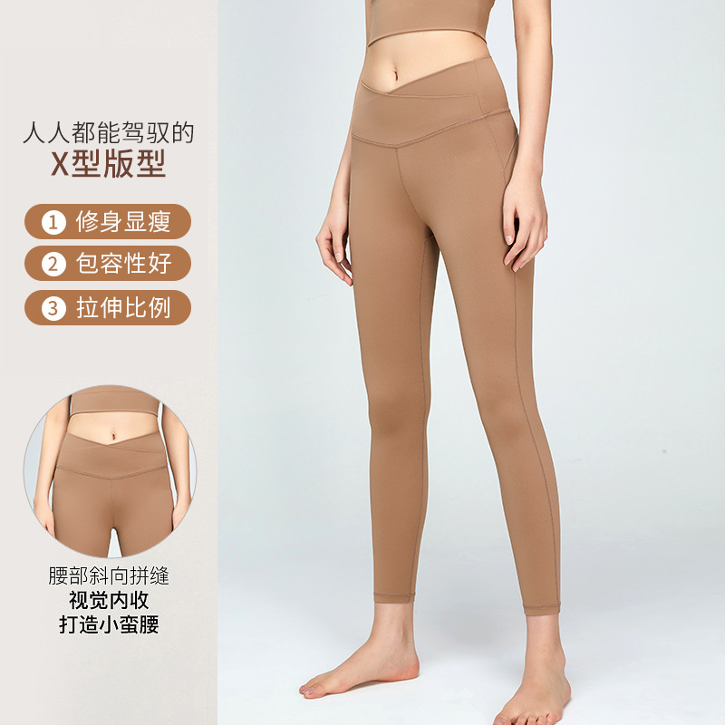 Cruz-frontera europea y americana ropa de yoga traje de mujer a prueba de golpes ropa interior de cintura alta Peach Hip apretado fitness deportes yoga Pantalones