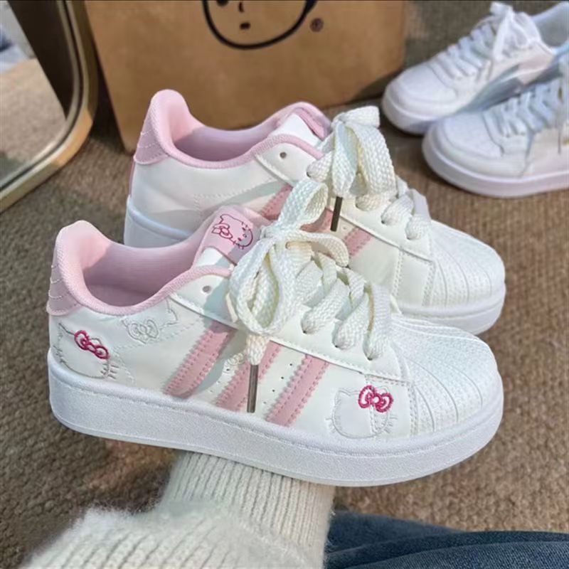 2026 primavera nuevo polvo blanco gato zapatos de pan de cabeza de concha de mujer estilo de escuela zapatos de skate de nicho zapatos deportivos bajos