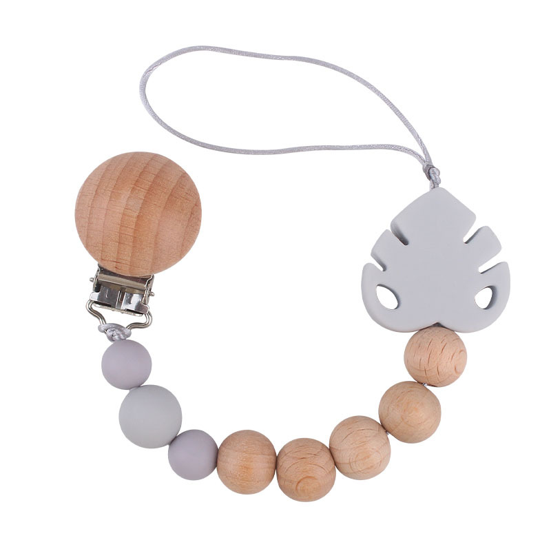 Suministros para bebés creativo haya chupete clip molar juguete mordedor bebé hoja de silicona chupete cadena anti-caída de la cadena