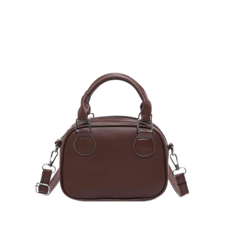 Otoño y invierno retro bolsas de bolos de mano tendencia 2024 nueva sensación extranjera Meilade bolsas de mujer de diseño simple bolso de mochila