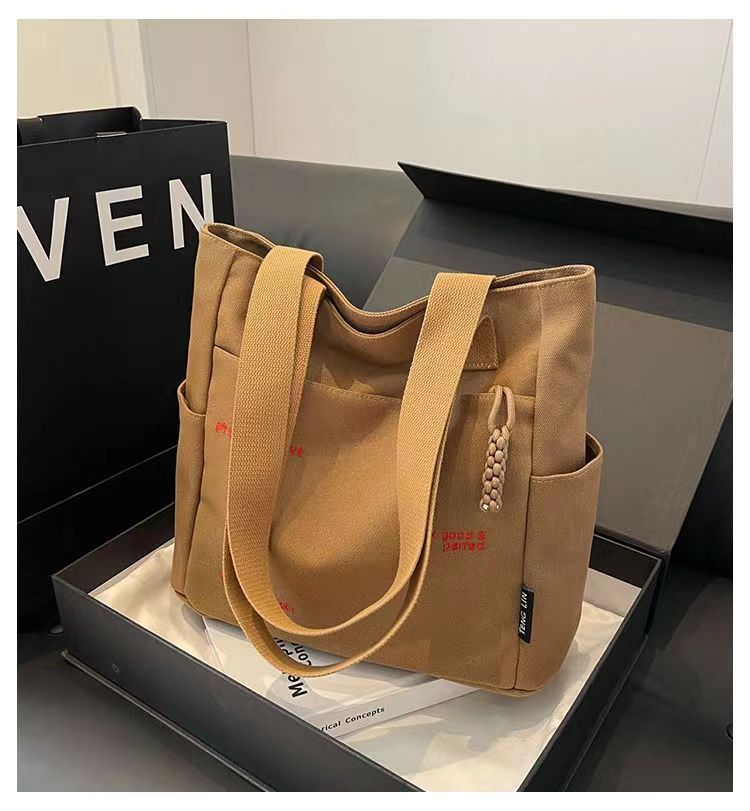 Bolsa de mano ligera para mujeres en clase de hombro único bolso de lienzo con cremallera de estilo coreano