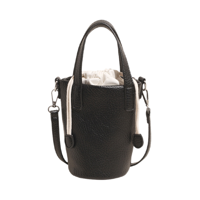 Bolso de cubo de cuero de cera de aceite retro con patrón de lichi transfronterizo para mujer 2025 nuevo bolso de mensajero de un solo hombro de diseño de nicho de alta gama