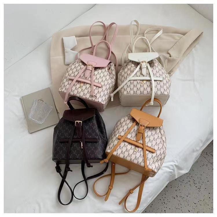 Mochila de hombro impresa de alta calidad para mujeres 2023 nueva moda en línea rojo universal fuera de gran capacidad explosiva