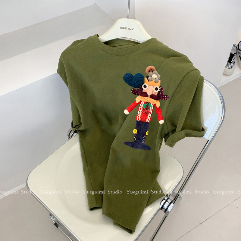 Green three dimensional cotton doll