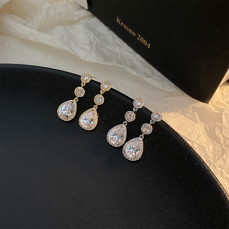 Fashionable sophisticated earrings with zircon drop-shaped