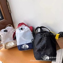 潮牌运动斜挎包休闲小包包街头男女机能手机包抽绳情侣同款单肩包