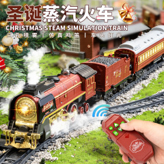 国境を越えたクリスマス復古蒸気小列車電動リモコン列車のおもちゃから煙が出て音光列車の軌道をシミュレートする