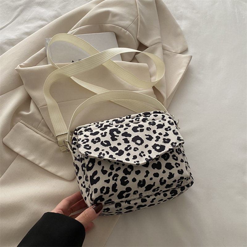 Casual nicho leopardo bolso damas 2024 nueva bolsa de lona de gran capacidad alta sensación de bolso pequeño bolso de teléfono móvil