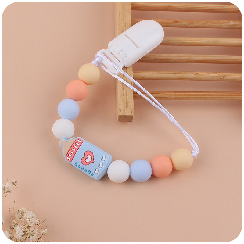 Nuevos suministros de bebé biberón de dibujos animados pequeño mordedor calmante bebé DIY cuentas de silicona mordedura molar Cadena de pezón