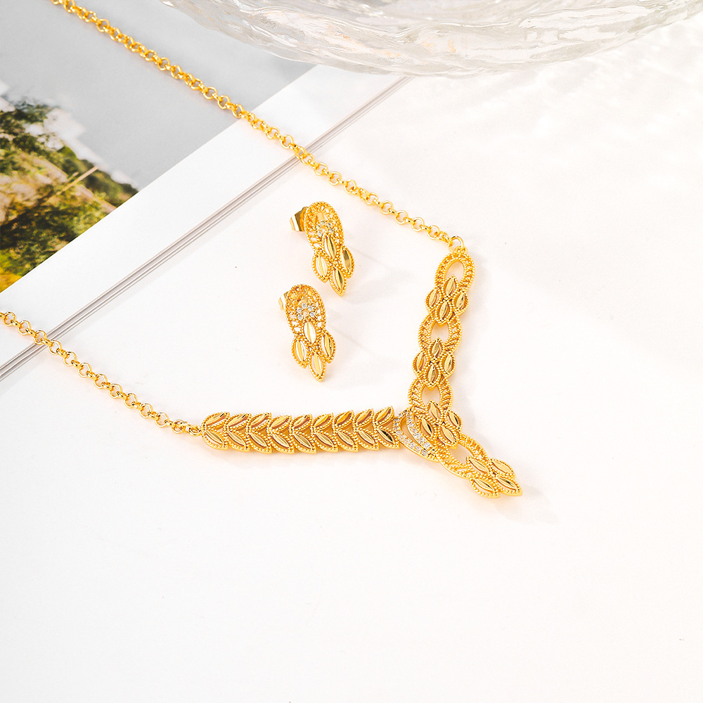 Joyería de moda europea y americana para mujeres bronce dorado pendientes de piedra de aluminio collar de dos piezas opciones de joyería transfronterizas