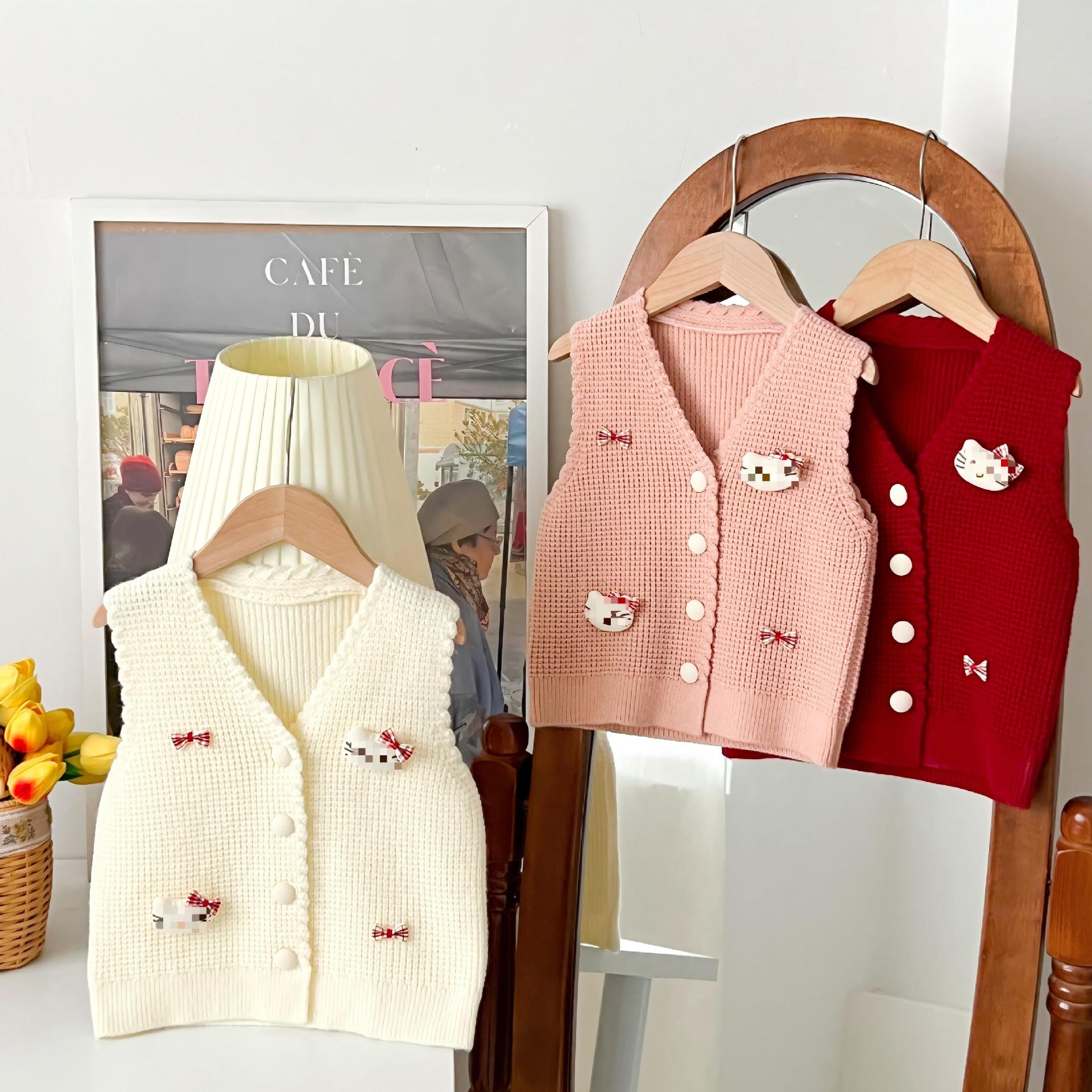 Retro color sólido V-collar chaleco cardigan bebé primavera y otoño nuevo estilo coreano de dibujos animados gatito arco chaleco de punto