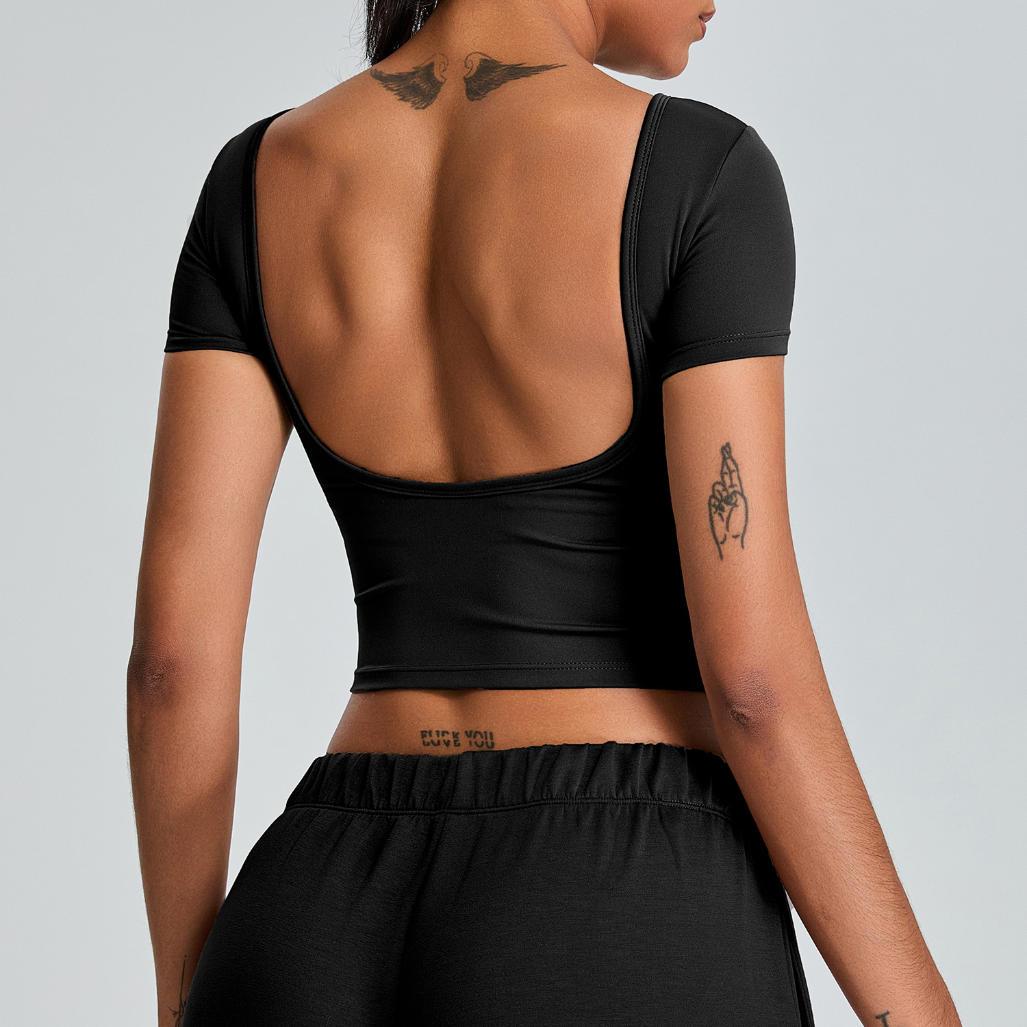 Tronos transfronterizos nueva ropa de yoga sin espalda para mujer, copa fija, espalda hermosa, top deportivo ajustado, de secado rápido, manga corta