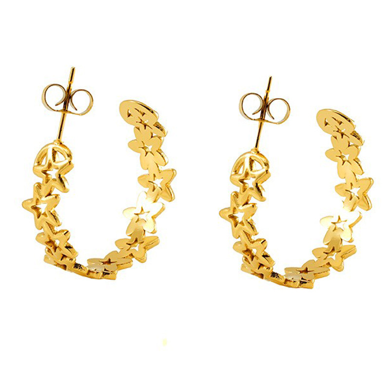 Nuevos pendientes de estrella de cinco puntas huecos de 18 quilates transfronterizos, diseño de nicho femenino, pendientes de personalidad de acero de titanio de moda simple al por mayor
