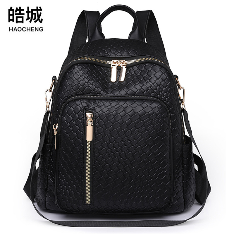 Bolsos para mujer 2024 nuevas señoras de nicho mochila de cuero suave moda tejida color sólido mochila de doble uso mochila escolar al por mayor