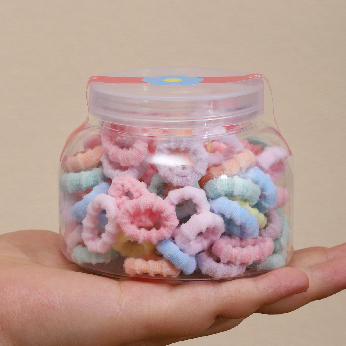 Cream-colored, 100-piece jar of anti-slip rings