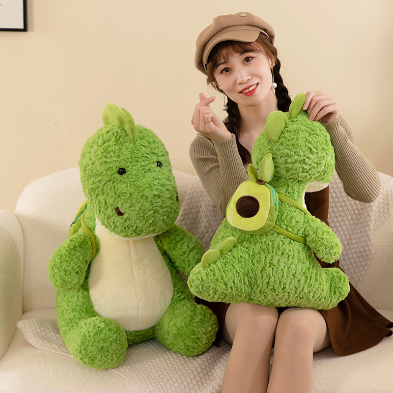 Nuevo aguacate mochila dinosaurio juguetes de peluche muñecas chicas regalo juguetes para niños muñecas de dibujos animados máquina de muñecas