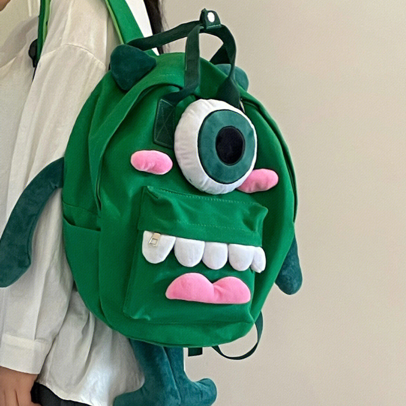 Mochila de lona para estudiantes de primaria lindo monstruo de un solo ojo dibujos animados japoneses ins campus hombres y mujeres muñeca mochila