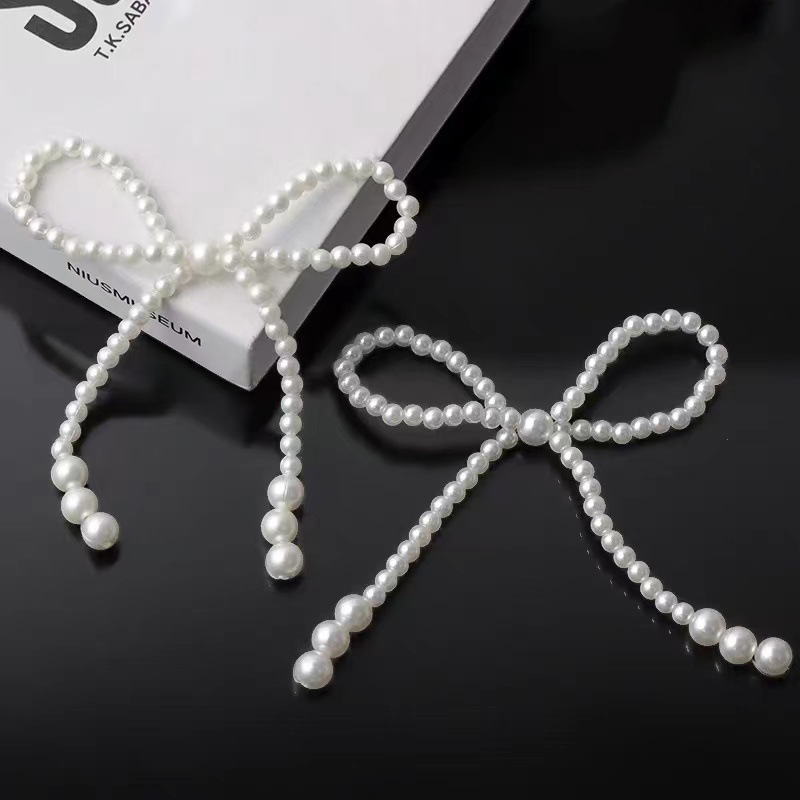 Popular online women's day decoration: pearl bow, pearl heart cake ornament, Women's Day birthday beaded item.