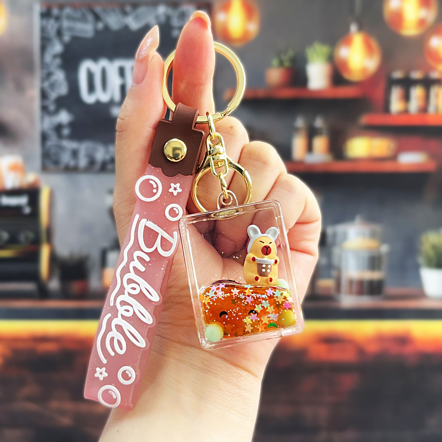 Nuevo aceitoso arena movediza taza de té con leche llavero colgante lindo divertido Kapibala llavero flotante pequeño regalo al por mayor