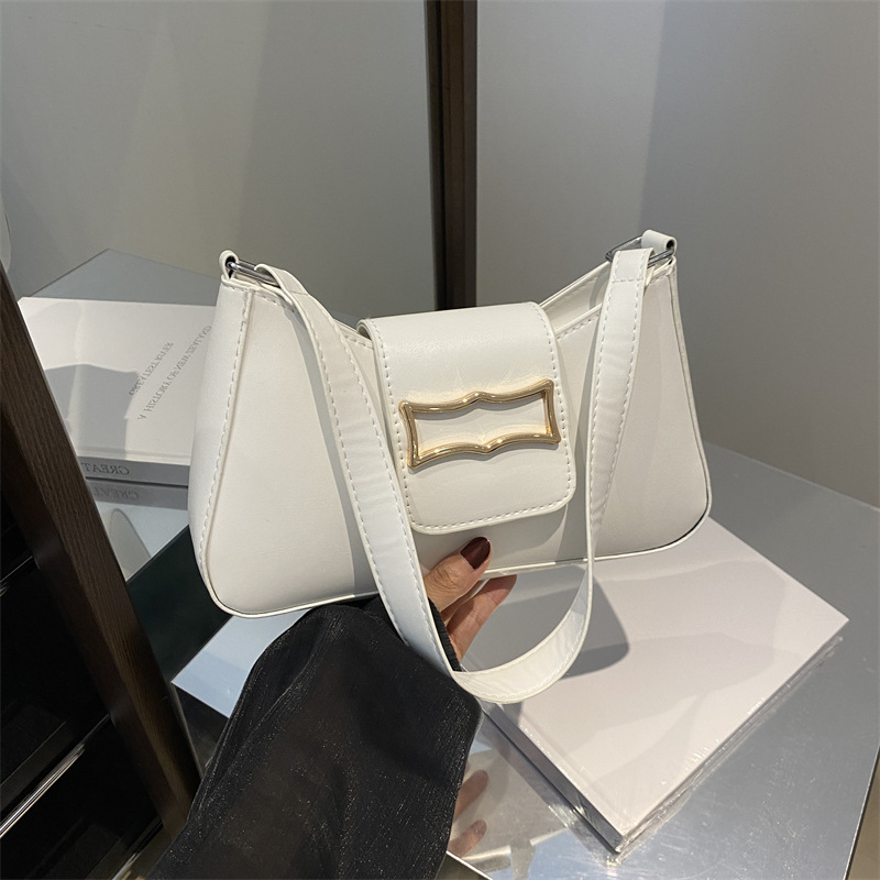 Bolso de brazo ligero de lujo para mujeres 2024 verano nuevo nicho de moda diseño de alta sensación ondulada mochila de hombro