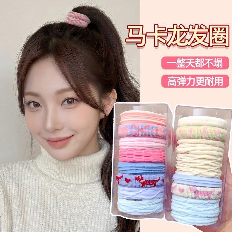 Nuevos artículos enlatados de base de color conjunto de banda de goma negro curry es fácil de usar diariamente para atar cabello de alta elasticidad