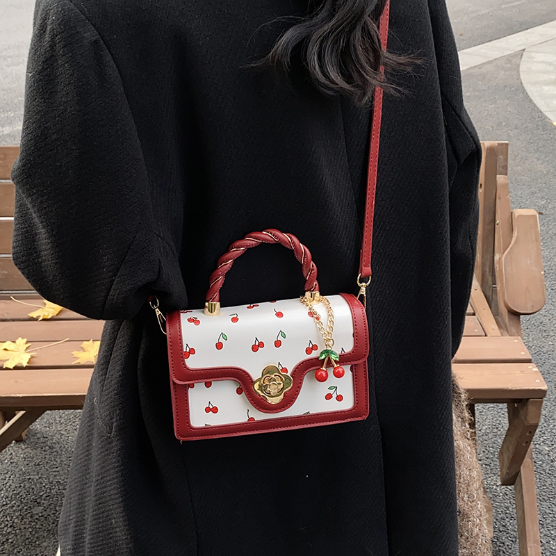 Bolso de moda coreano 2024 otoño e invierno nuevo bolso femenino lindo bolso de hombro de cereza estilo occidental color contraste bolso de mensajero marea