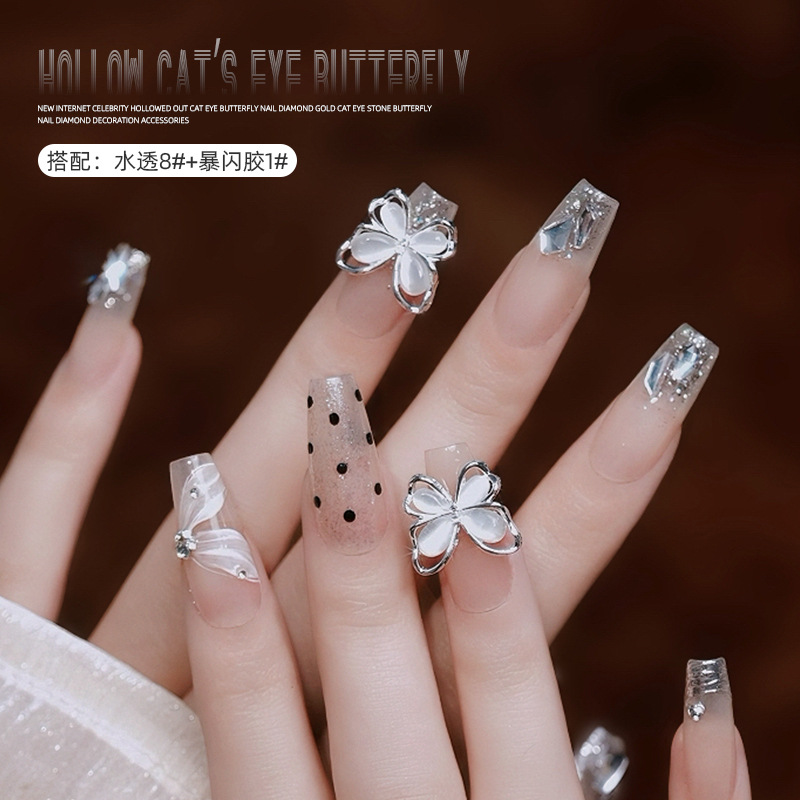 Uñas de cristal gato ojo mariposa aleación joyería en línea celebridad uñas hueco mariposa desgaste accesorios de uñas al por mayor