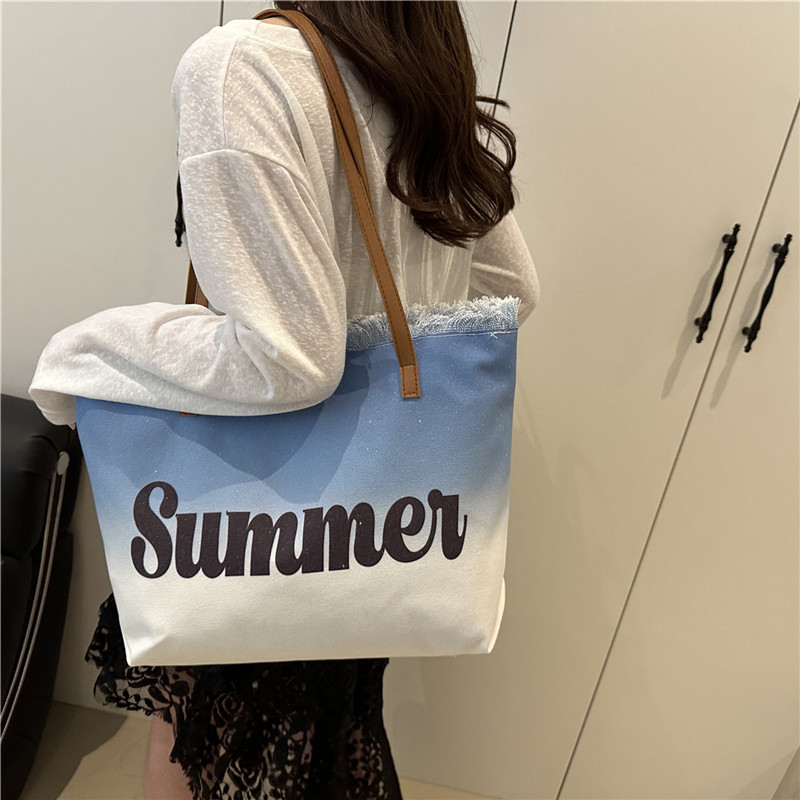 夏の新しいスタイルのタッセルローエッジデザインハンドバッグクロスボーダーレジャー休暇グラデーションカラー美しいショルダー脇の下バッグ|undefined