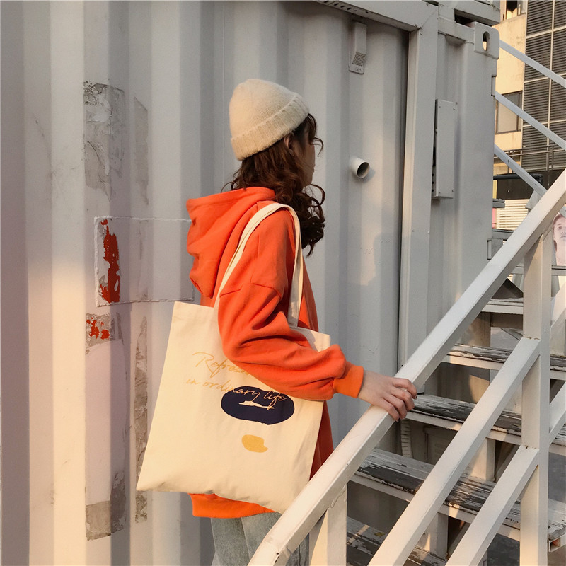 E131 canvas bag, Korean-style ins hand-held shoulder bag, color block letter graffiti shopping bag, female student's search for sources undefined