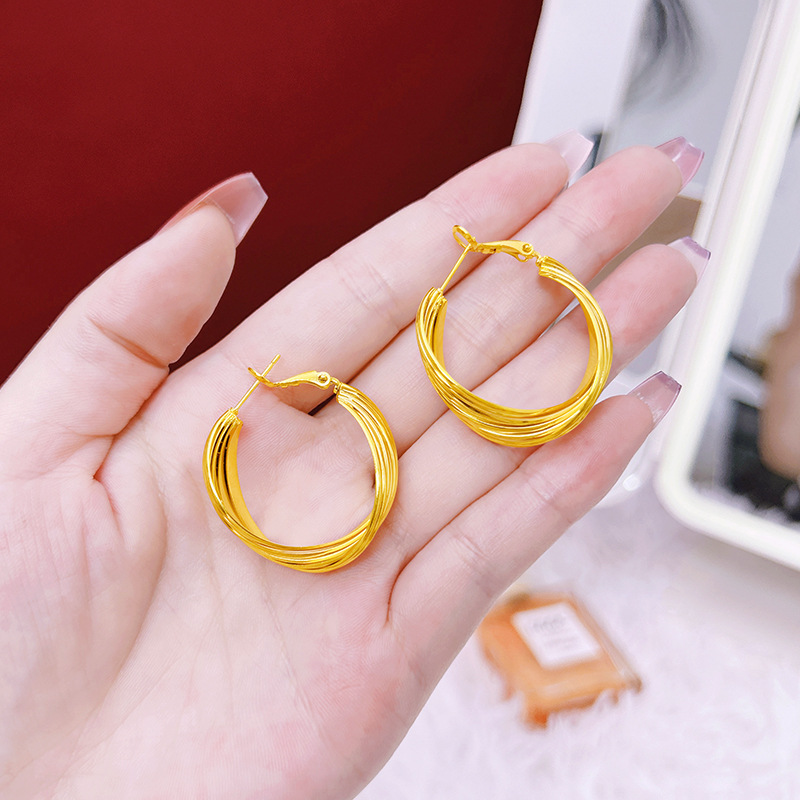 2023 nuevos pendientes de las mujeres Mobius anillo imitación oro multi-capa pendientes Cruz diseño online pendientes populares