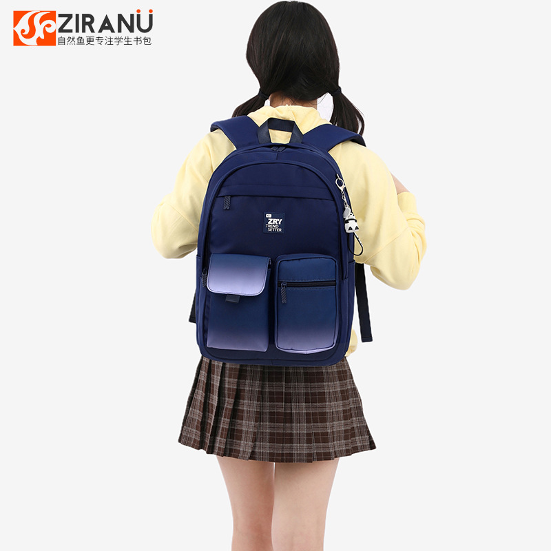 Venta caliente de pescado natural nuevo estudiante mochila estudiante de la escuela primaria gran capacidad femenina 2-6 grado joven ventilador mochila entrega