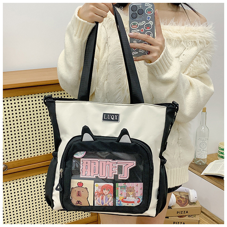 The new cute cartoon printed student bag with a large capacity and transparent student storage single-shoulder bag is selling well for women undefined