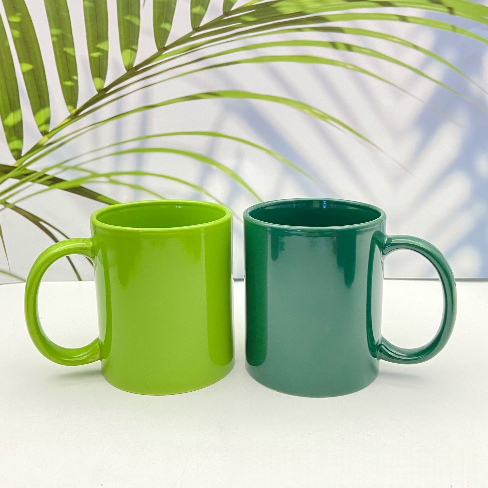 Fabricantes de tazas de cerámica personalizadas al por mayor suministro directo de comercio exterior 11oz impresión LOGO taza de sublimación de transferencia de calor hueso taza de agua de porcelana