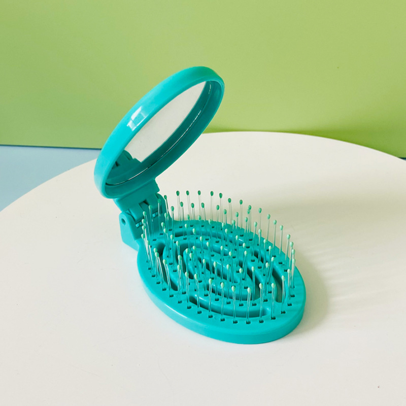 Hogar portátil de viaje cojín de aire peine hueco plegable masaje peine mini hueso contar peine pequeño con espejo al por mayor