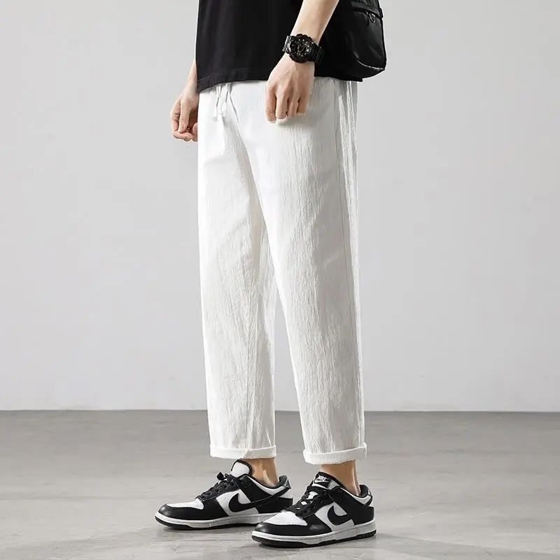 Pantalones de hombre de estilo chino pantalones de lino sueltos casuales primavera y verano pantalones harem de pierna ancha de lino de algodón recto fino linterna