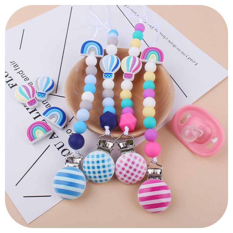 Nuevo bebé dibujos animados globo de aire caliente pulsera de silicona teether palo pezón cadena anti-gota cadena juguete teether