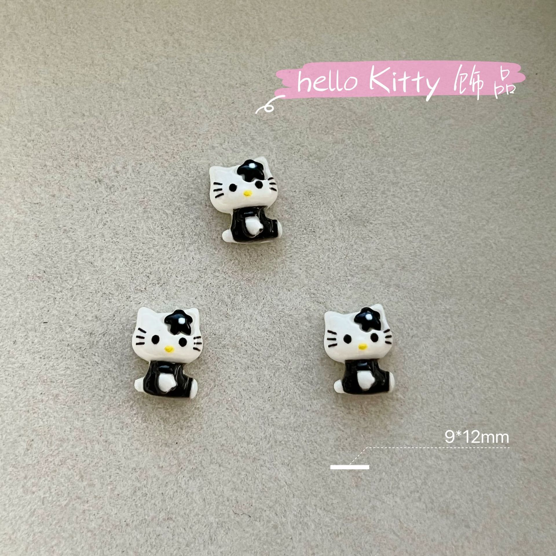 新商品のキティキャットの三麗鴎のネイルアクセサリーのネットの赤い爆発の樹脂のかわいいkt猫は甲を着て飾ります。