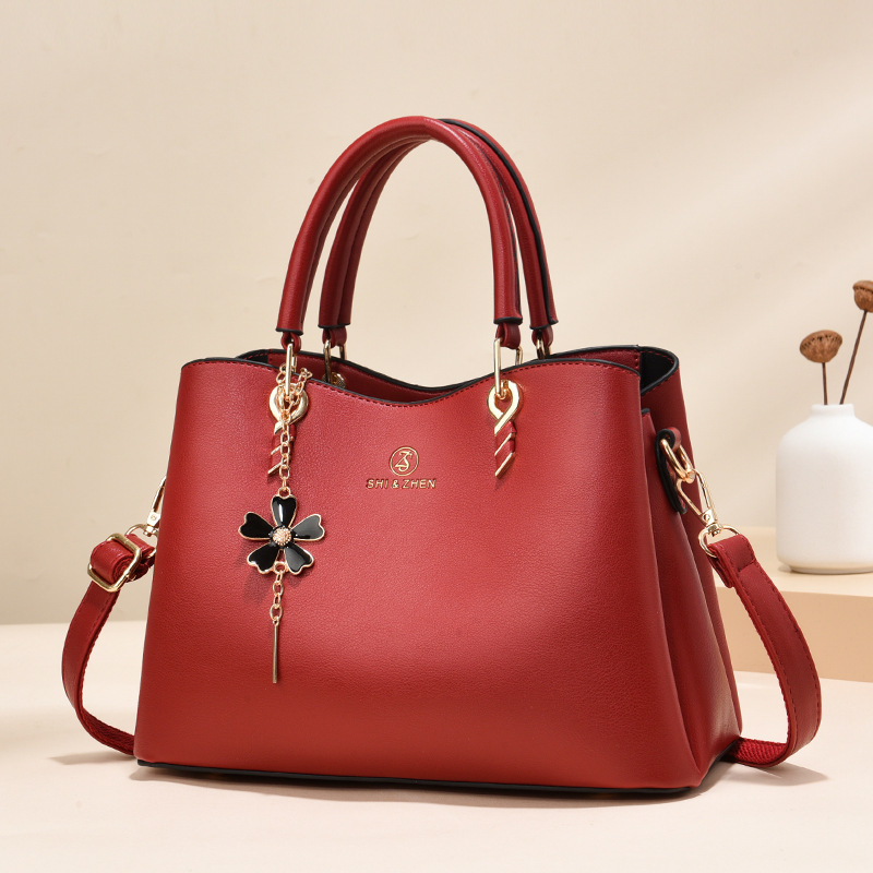 Colgante de flores bolsas de mano de color sólido de gran capacidad de moda versátil bolsas de hombro ocio de viaje oblicuo bolsas transfronterizas