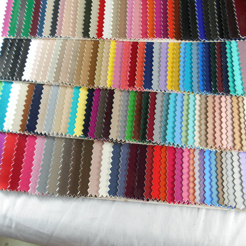 漆皮0.8MM无痕镜面PU毛底彩色镜面人造革 高光无痕PU耐压折手袋革