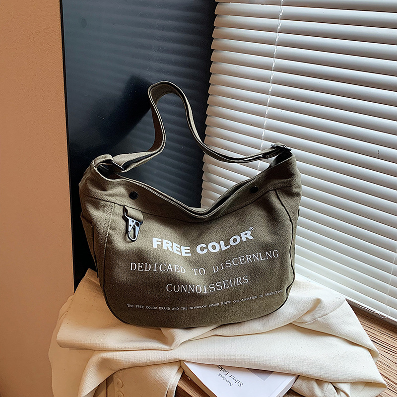 Bolsa de lona para mujeres 2026 nueva bolsa de gran capacidad transfronteriza impresa letras de viaje casual mochila de hombro