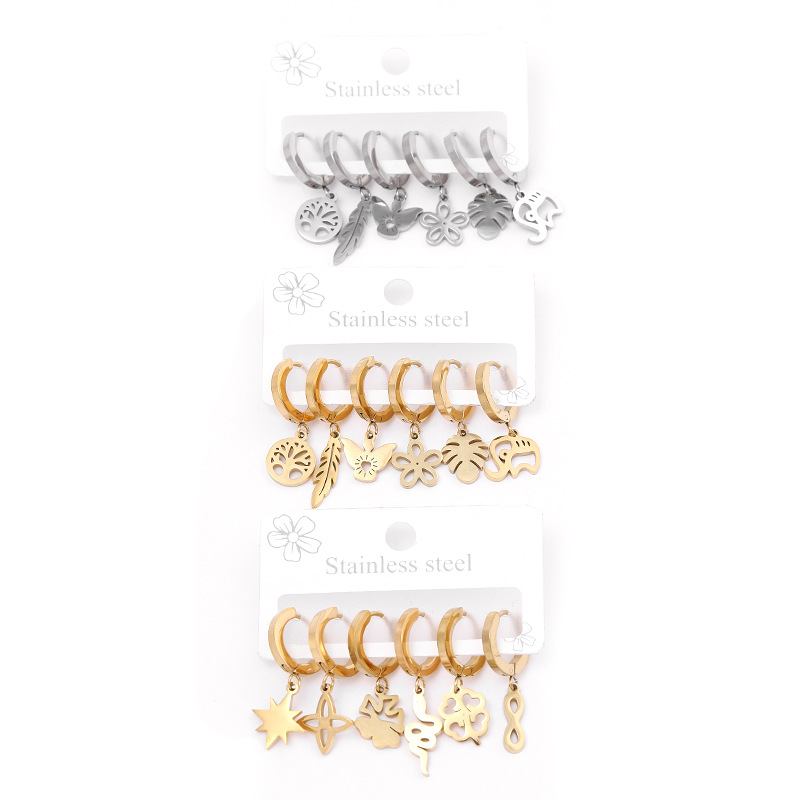 Joyería de acero inoxidable transfronterizo corte hueco flor planta Awn estrella patrón geométrico oreja dorada hebilla traje fabricante