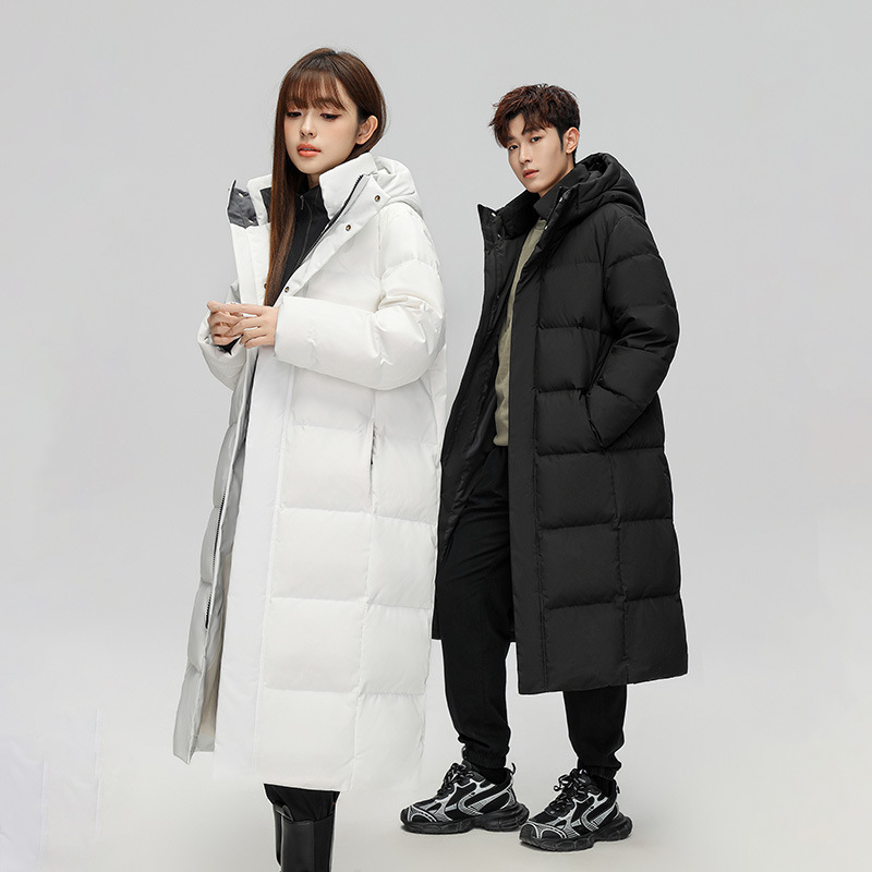 Chaqueta de plumón para hombres y mujeres mediana y larga en invierno de 2025 nuevos productos sobre la rodilla alargada y gruesa tendencia de chaqueta de hombre
