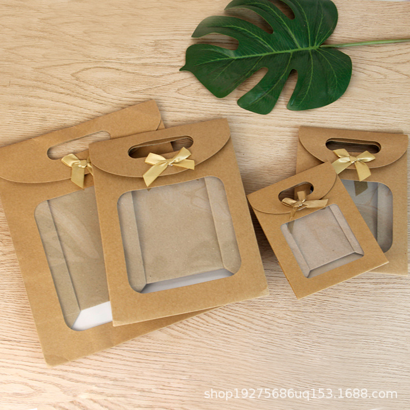 Bolsa de embalaje transparente de la ventana del arco del tirón en stock bolso al por mayor bolsa de papel de embalaje de regalo bolsa de regalo grande