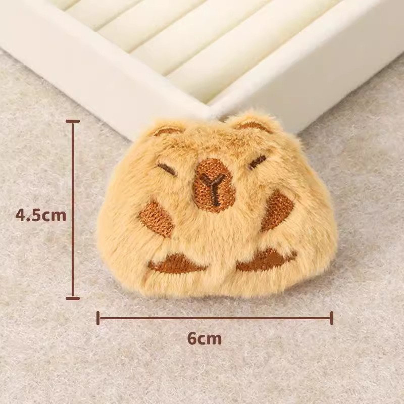 Capibara peluche pequeño colgante bolso muñeca broche muñeca adorable muñeca máquina peluche accesorios bolsas de pluma al por mayor