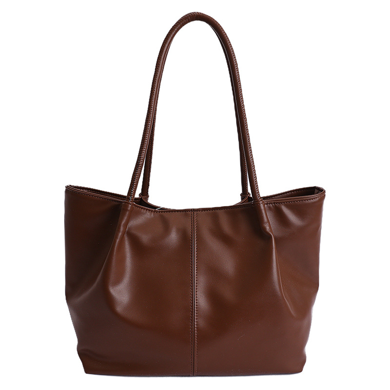 Bolso 2026 nuevo retro bolso de hombro de transporte de gran capacidad bolso de mujer simple y versátil bolso de brazo portátil